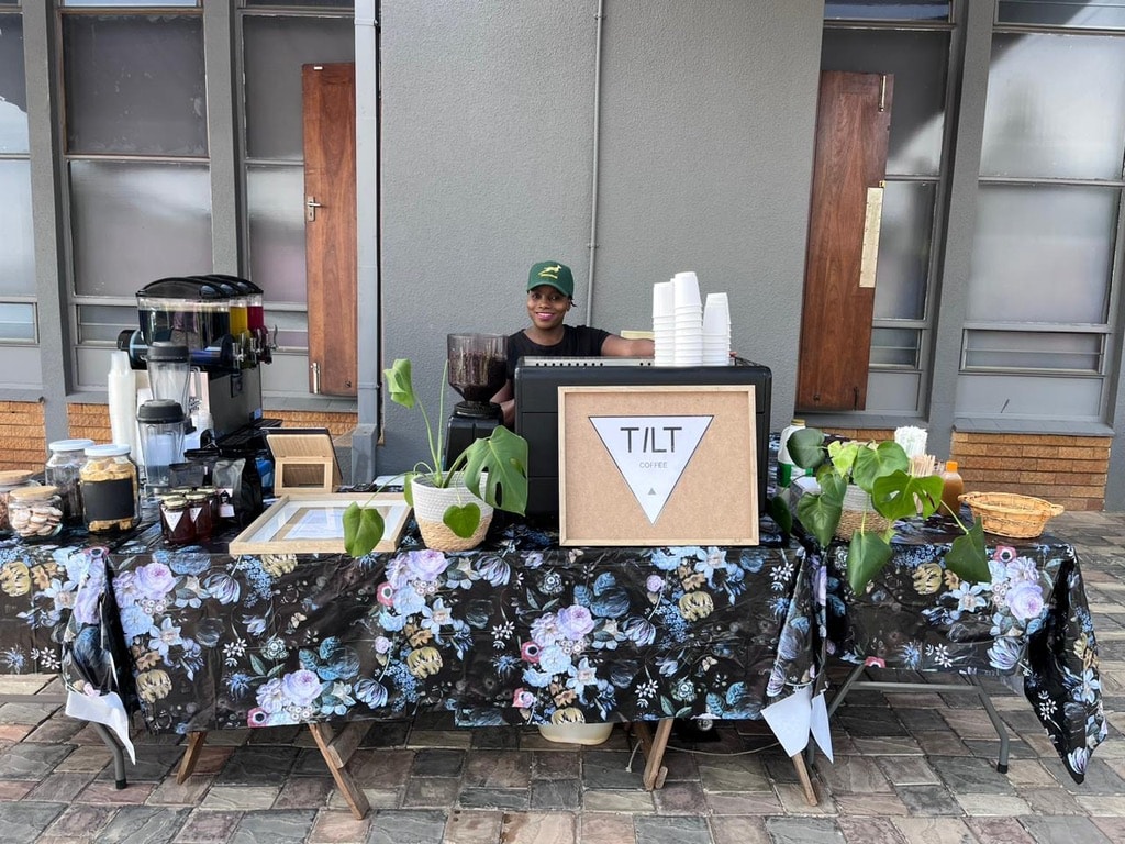 Tilt Coffee table coffee cart setup with espresso machine and barista